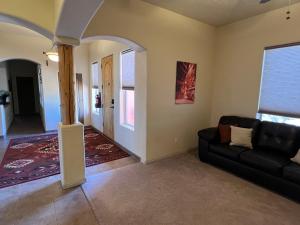 a living room with a couch and a table at Spacious Home in Page