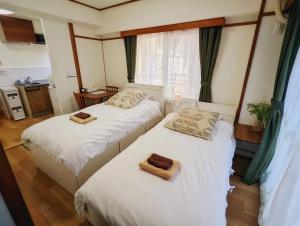 Amber Iidabashi - Vacation STAY 89899v tesisinde bir odada yatak veya yataklar