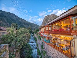 a hotel with views of a river and mountains at Sol Ollantay Boutique Hotel in Ollantaytambo