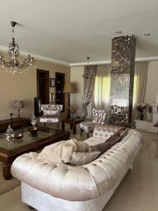a living room with a couch and a table at Botola Home 2 in Casablanca
