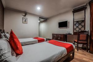 Katil atau katil-katil dalam bilik di OYO Athithi Inn Near Hyderabad Central
