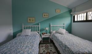Llit o llits en una habitació de Villa Frasquita