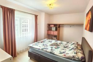 A bed or beds in a room at Select Apartment SIBIU