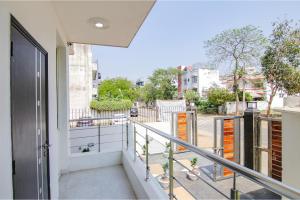 an apartment balcony with a view of a street at Hotel Leaf 9, Cyber City near Ambience Mall in Gurgaon