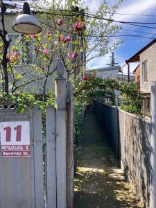 an alley with a fence and a street light at 4 Brothers in Kutaisi