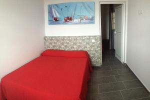 Hotel Playa de Arinaga tesisinde bir odada yatak veya yataklar