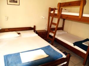 Postel nebo postele na pokoji v ubytování Pension Posidon