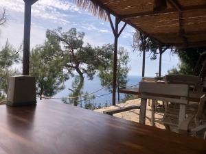 a table with a view of the ocean at Kabak Ütopya Suites in Faralya