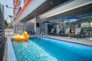 a pool with a rubber duck in the middle of it at Akira Pattaya in Jomtien Beach