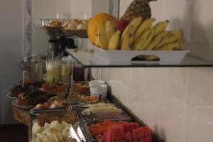 a buffet with a bunch of different types of food at Hotel Litoral in Aracaju