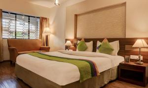 Treebo Five Elements, Lonavala客房内的一张或多张床位