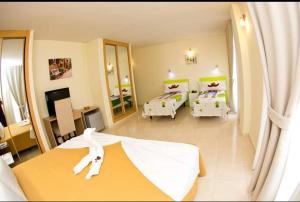 A bed or beds in a room at Hostal San Marcos