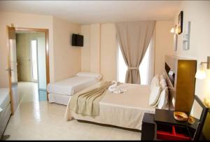 A bed or beds in a room at Hostal San Marcos
