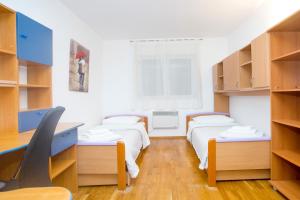 a bedroom with two beds and a window at Deluxe apartment Lea with large garden in Split