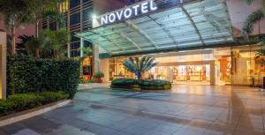 a shopping mall with a sign that reads movedel at Novotel Bengaluru Outer Ring Road in Bangalore