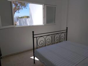 Ένα ή περισσότερα κρεβάτια σε δωμάτιο στο Casa playa de Mazagón