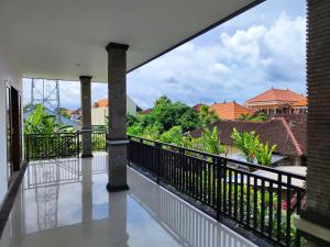 a balcony with a view of the city at LA Homestay sanur in Sanur