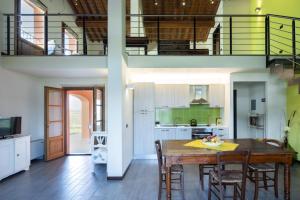 a kitchen and dining room with a table and chairs at Incanto Toscano in Larciano