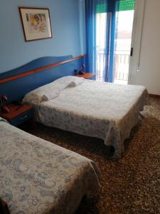 Postel nebo postele na pokoji v ubytování Hotel Trifoglio