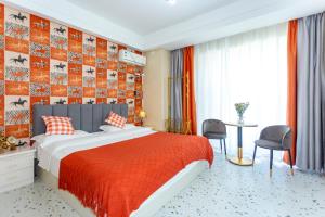 A bed or beds in a room at Dalian Hong Xi Yuan Apartment Wanda Plaza