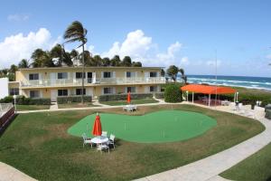 a resort with a putting green and a golf course at Delray Breakers on the Ocean in Delray Beach