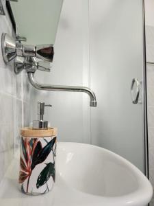 a bathroom with a sink and a faucet and a toilet at Apartment Dolores in Cres