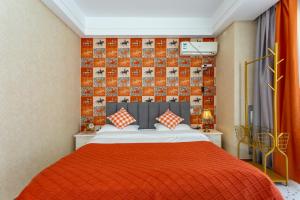 A bed or beds in a room at Dalian Hong Xi Yuan Apartment Wanda Plaza