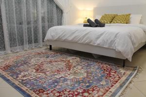Postel nebo postele na pokoji v ubytování Newly furnished cozy 1 bedroom apartment close to JBR beach and metro