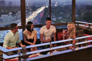 a group of people standing on the top of a building at Hotel Angeleno in Los Angeles