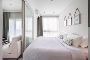 Ένα ή περισσότερα κρεβάτια σε δωμάτιο στο Veranda Residence/1BR/25th floor +26 φωτογραφίες