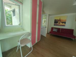 Postel nebo postele na pokoji v ubytování Rayonghouse Resort