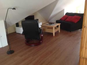 O zonă de relaxare la Ferienwohnung Studiowohnung, offener Wohn- und Schlafber