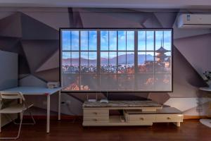 TV a/nebo společenská místnost v ubytování Dalian Hong Xi Yuan Apartment Wanda Plaza