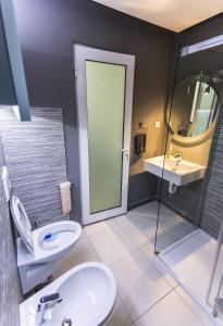 a bathroom with a toilet and a sink at Apartment Nevena in Belgrade