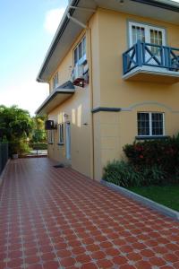 a house with a red brick driveway at Casa del Sol Tobago in Bon Accord Village