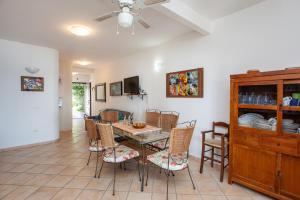a dining room with a table and chairs at casa sulla spiaggia 2 in Orosei