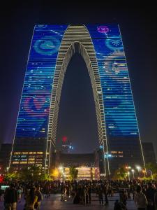 a large building with an arch in front of it at SuzhouGoethe Apartment in Suzhou