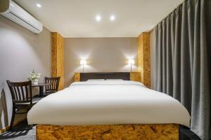 Postel nebo postele na pokoji v ubytování 26 HOTEL