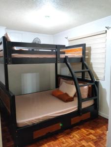 a bunk bed room with two bunk beds at Comfy Dwelling in Baguio