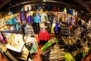 a store with a bunch of clothes on display at Alyeska Resort in Girdwood