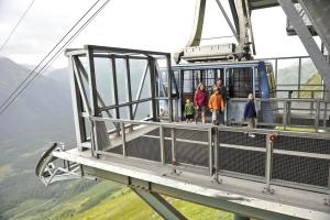 a group of people on a gondola in the sky at Alyeska Resort in Girdwood