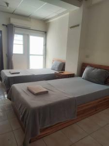 Postel nebo postele na pokoji v ubytování Soi 5 Apartment