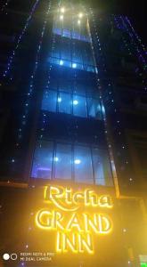 a building with a sign that reads rutherford grand inn at Flagship Richa Grand Inn Near Sahara Ganj Mall in Lucknow