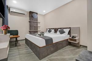 Кровать или кровати в номере Townhouse OAK Hotel Rudra