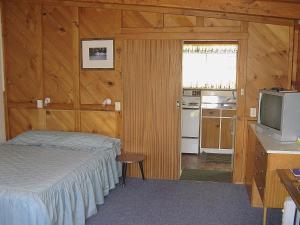 מיטה או מיטות בחדר ב-Tongariro River Motel