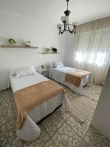 Postel nebo postele na pokoji v ubytování Casa Teresa