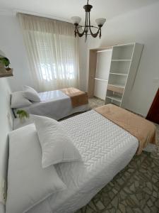 Postel nebo postele na pokoji v ubytování Casa Teresa