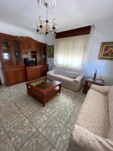 a living room with a couch and a coffee table at Casa Teresa in Redondela