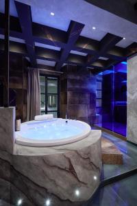 a large bathroom with a large tub in a room at Mamaco I Teatro in Foggia