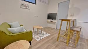A television and/or entertainment centre at See U Tainan Apartment